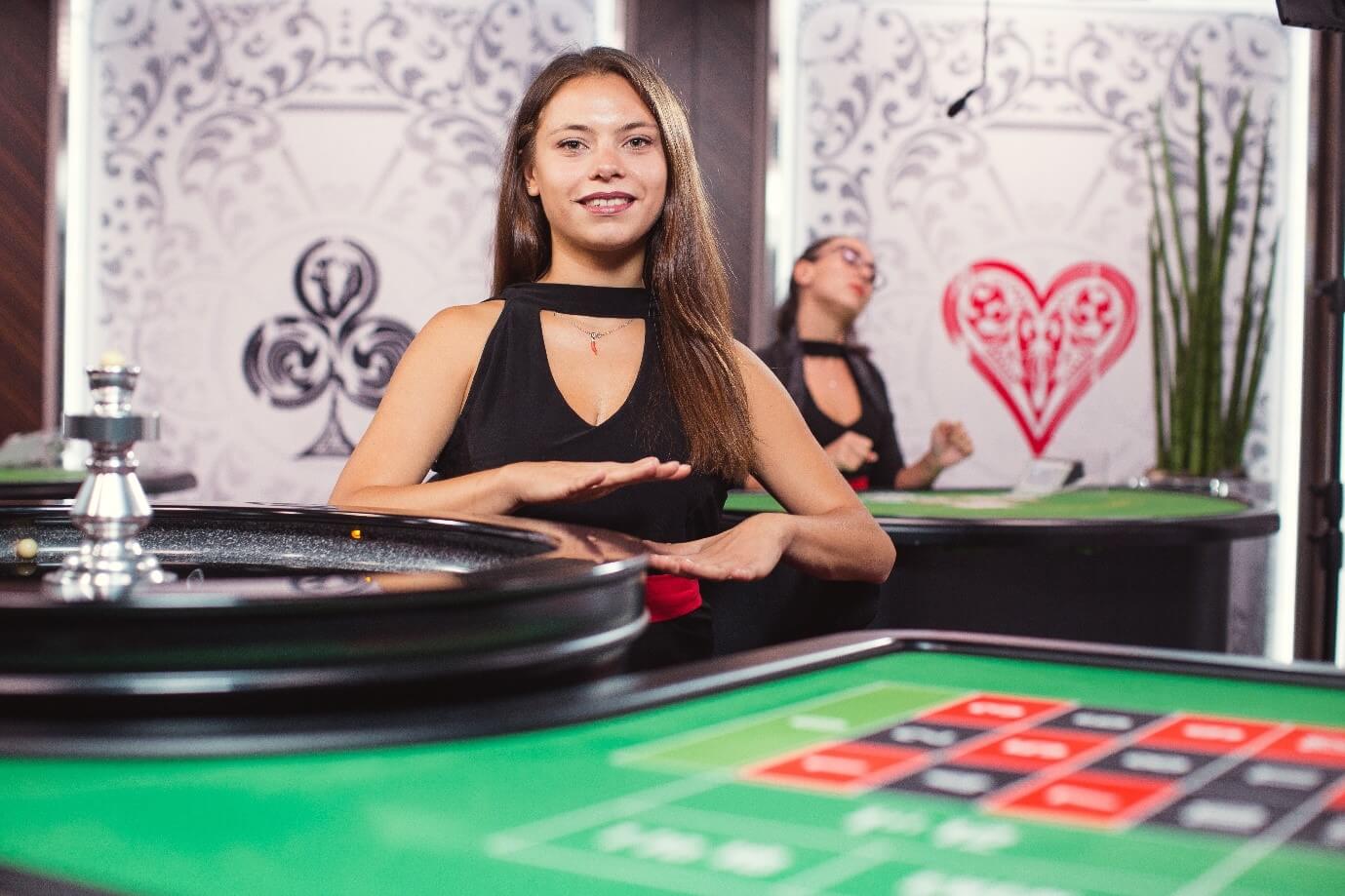 Croupier indicates no more bets at Evolution Gaming live roulette casino table